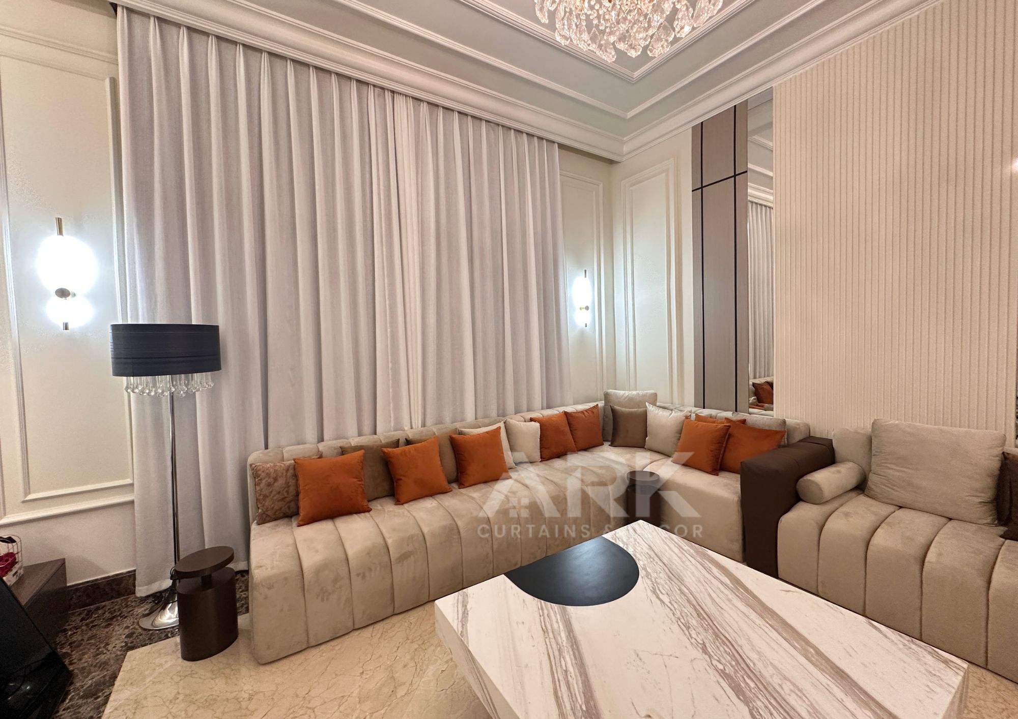 Modern living room with wave-fold curtains