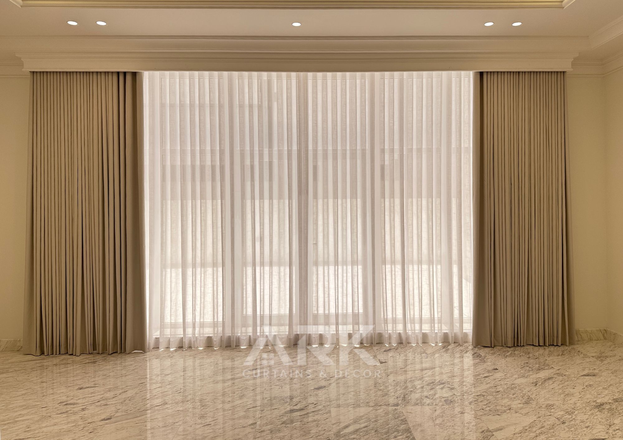 Contemporary living room with layered curtains