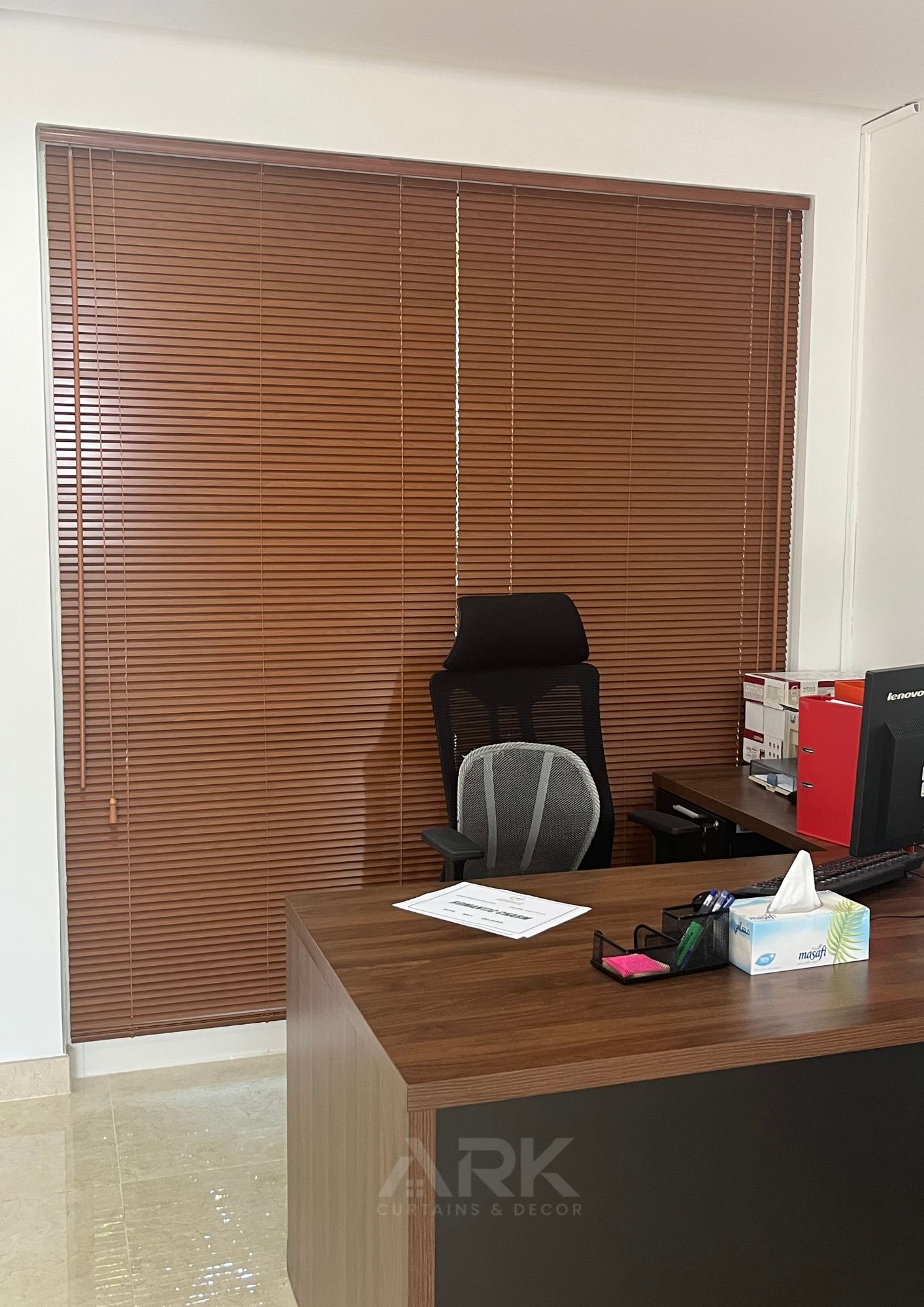 Warm wooden venetian blinds in an office setting