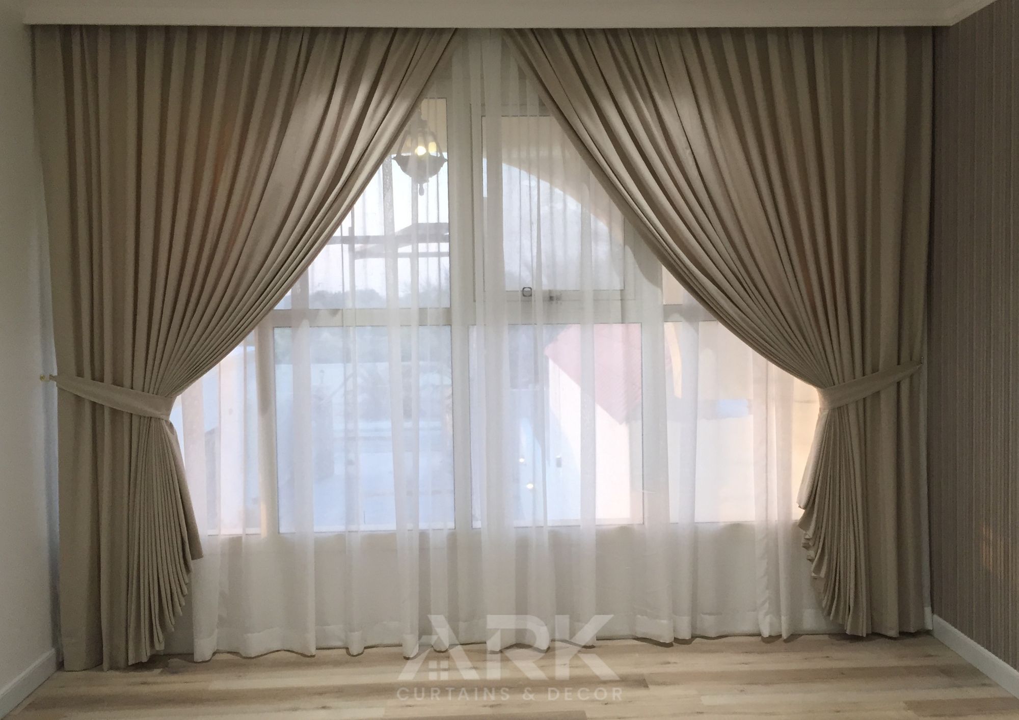 Luxurious living room with full-length curtains